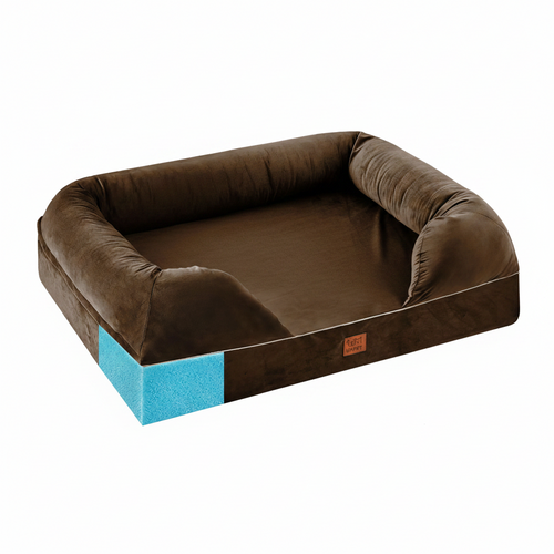 Dog lying on a brown pet bed with blue foam padding